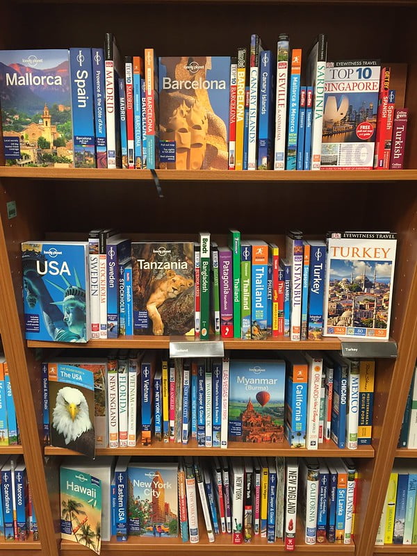 A bookcase filled with travel guides. A scientific paper is kind of like a travel guide for your data.