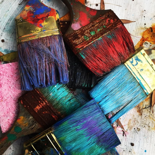 Paint brushes in different colours representing creativity.